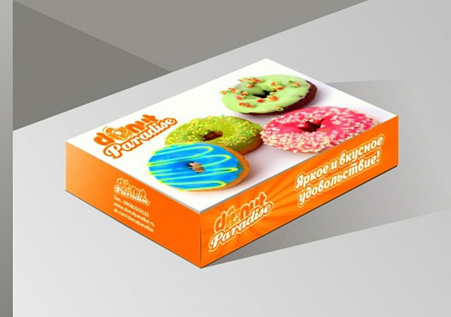 На фотографии разработаный дизайн оформление упаковки коробки для пончиков веб студией VDcom.